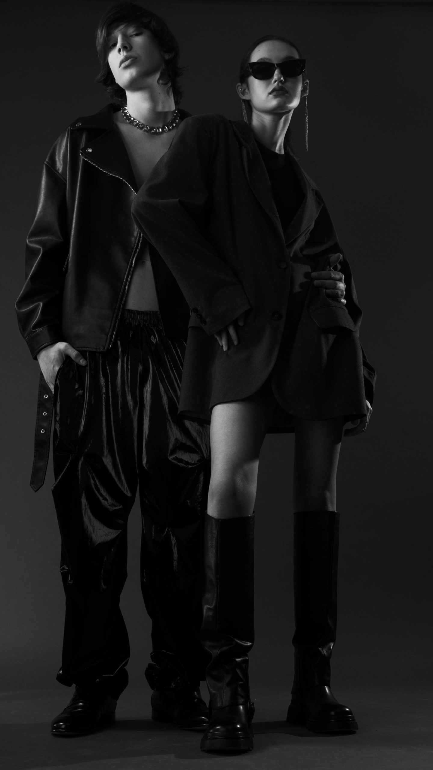 Two fashion models in black leather looks