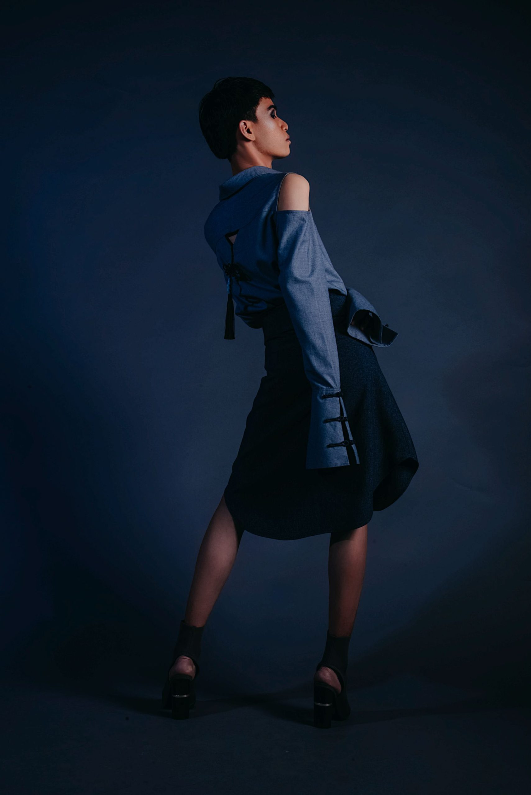 Fashion model in an architectural blue outfit