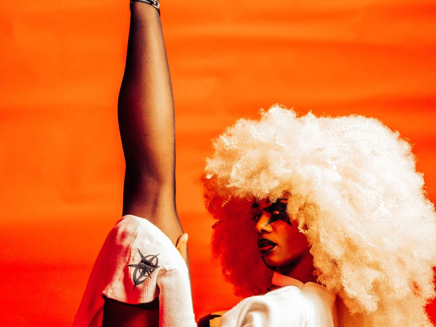 Fashion portrait in warm orange and red tones