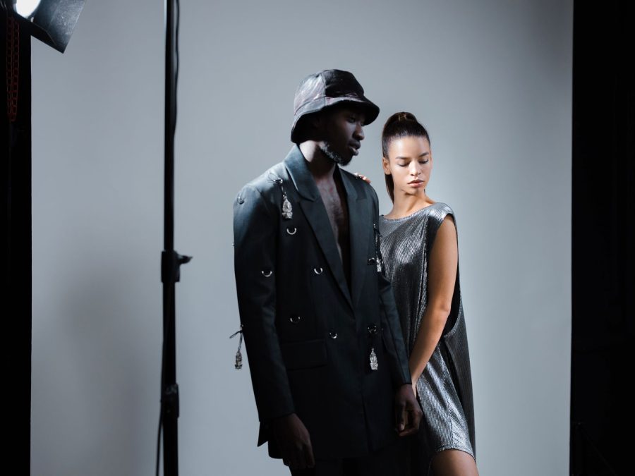 Two models posing in a fashion studio